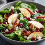 Apple Spinach Salad with Pecans: A Flavorful Delight! 3 Apple Spinach Salad with Pecans, Cranberries, Goat Cheese, and homemade Maple-Lime Mustard Dressing.